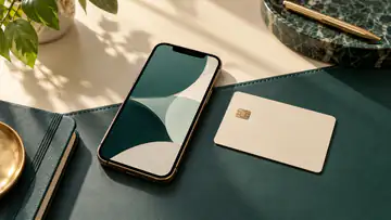 A phone, a payment card and a transaction notebook